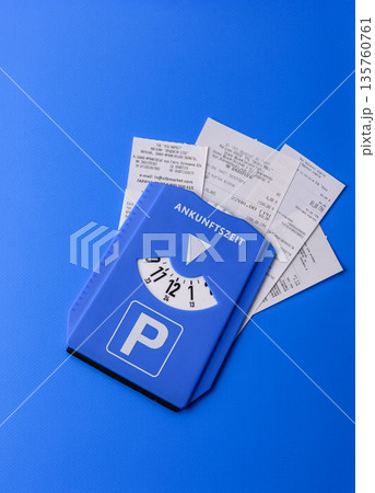 A parking disc, permit, or ticket for measuring time and paying municipal services. A parking disc 135760761