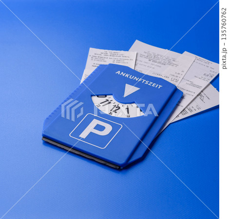 A parking disc, permit, or ticket for measuring time and paying municipal services. A parking disc 135760762