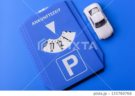 A parking disc, permit, or ticket for measuring time and paying municipal services. A parking disc A parking disc, permit, or ticket for measuring time and paying municipal services. A parking disc 135760768