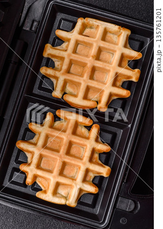 Belgian waffles, a healthy sweet breakfast dessert, food background. Belgian waffles 135761201