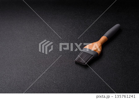 Brush, silicone kitchen utensils for cooking and baking at home. Silicone brush Brush, silicone kitchen utensils for cooking and baking at home. Silicone brush 135761241