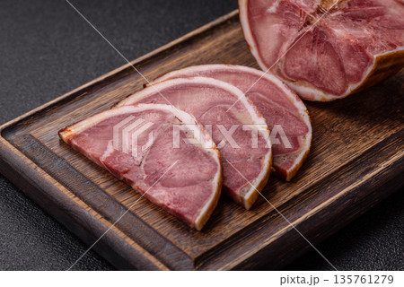 A meat roll made from pork or beef tongue slices with spices. Tongue roll A meat roll made from pork or beef tongue slices with spices. Tongue roll 135761279