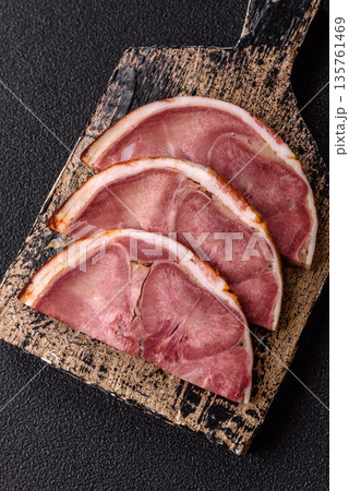 A meat roll made from pork or beef tongue slices with spices. Tongue roll A meat roll made from pork or beef tongue slices with spices. Tongue roll 135761469