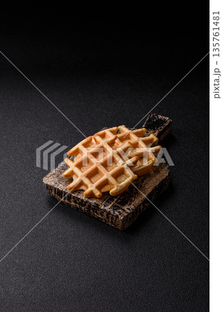 Belgian waffles, a healthy sweet breakfast dessert, food background. Belgian waffles Belgian waffles, a healthy sweet breakfast dessert, food background. Belgian waffles 135761481