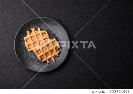 Belgian waffles, a healthy sweet breakfast dessert, food background. Belgian waffles 135761491