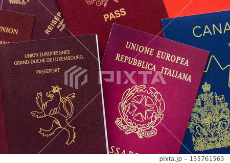 Passports of citizens of different countries of the world, passports background Passports of citizens of different countries of the world, passports background 135761563