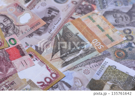 Money background, currency exchange, paper banknotes from different countries. Money cash currency Money background, currency exchange, paper banknotes from different countries. Money cash currency 135761642