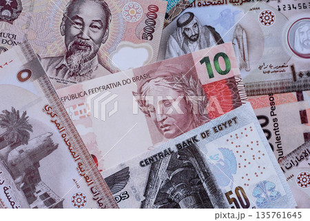 Money background, currency exchange, paper banknotes from different countries. Money cash currency Money background, currency exchange, paper banknotes from different countries. Money cash currency 135761645