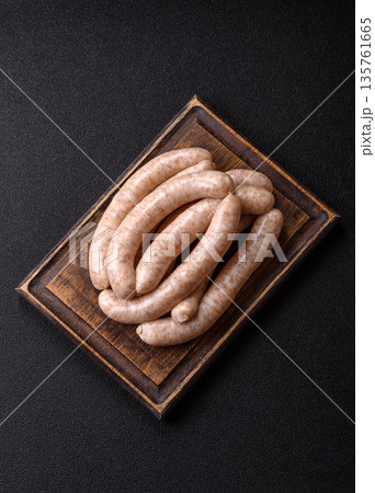 Raw pork or chicken meat sausages for grilling, a spicy picnic food. Raw sausages 135761665