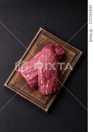 Raw meat, fresh beef tenderloin or filet mignon for grilling. Raw beef tenderloin Raw meat, fresh beef tenderloin or filet mignon for grilling. Raw beef tenderloin 135761695
