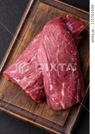 Raw meat, fresh beef tenderloin or filet mignon for grilling. Raw beef tenderloin Raw meat, fresh beef tenderloin or filet mignon for grilling. Raw beef tenderloin 135761699