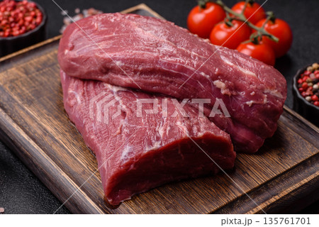 Raw meat, fresh beef tenderloin or filet mignon for grilling. Raw beef tenderloin Raw meat, fresh beef tenderloin or filet mignon for grilling. Raw beef tenderloin 135761701