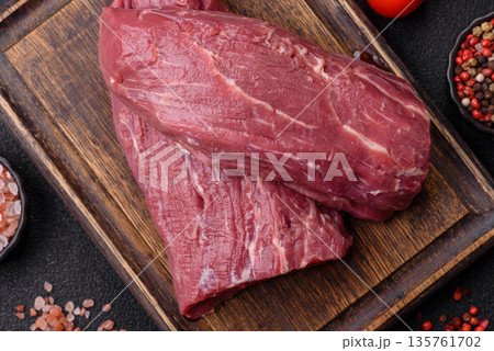 Raw meat, fresh beef tenderloin or filet mignon for grilling. Raw beef tenderloin 135761702