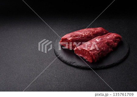 Raw meat, fresh beef tenderloin or filet mignon for grilling. Raw beef tenderloin Raw meat, fresh beef tenderloin or filet mignon for grilling. Raw beef tenderloin 135761709