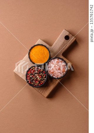 Indian spices, pepper, salt, turmeric, ingredients for cooking. Spices pepper, salt, and turmeric Indian spices, pepper, salt, turmeric, ingredients for cooking. Spices pepper, salt, and turmeric 135761742