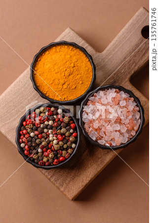 Indian spices, pepper, salt, turmeric, ingredients for cooking. Spices pepper, salt, and turmeric Indian spices, pepper, salt, turmeric, ingredients for cooking. Spices pepper, salt, and turmeric 135761746