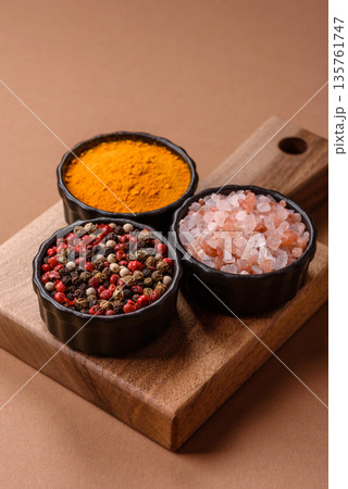 Indian spices, pepper, salt, turmeric, ingredients for cooking. Spices pepper, salt, and turmeric 135761747