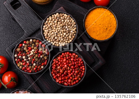 Indian spices, pepper, salt, turmeric, ingredients for cooking. Spices pepper, salt, and turmeric 135762106
