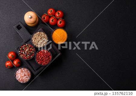 Indian spices, pepper, salt, turmeric, ingredients for cooking. Spices pepper, salt, and turmeric Indian spices, pepper, salt, turmeric, ingredients for cooking. Spices pepper, salt, and turmeric 135762110