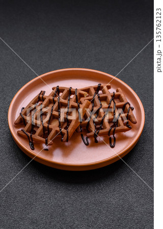Belgian waffles, a healthy sweet breakfast dessert, food background. Belgian waffles Belgian waffles, a healthy sweet breakfast dessert, food background. Belgian waffles 135762123