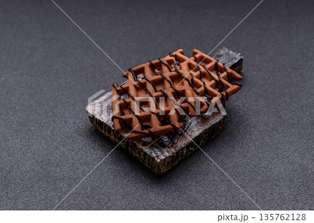 Belgian waffles, a healthy sweet breakfast dessert, food background. Belgian waffles 135762128