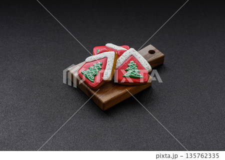 Gingerbread, Christmas cookies, and ornamental holiday baked goods. Christmas gingerbread Gingerbread, Christmas cookies, and ornamental holiday baked goods. Christmas gingerbread 135762335