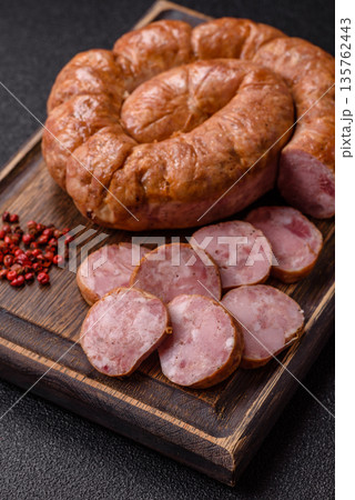 Grilled sausage in the shape of a spiral or snail, from chicken or pork. Spiral or snail sausage 135762443