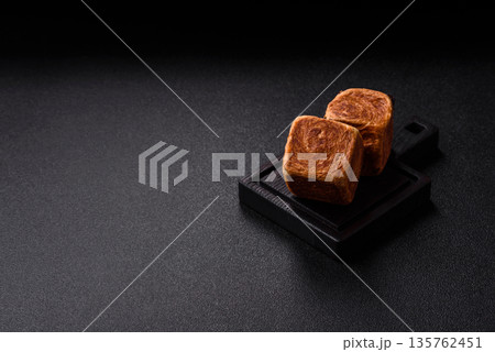 A French cube croissant with chocolate filling, a sweet breakfast pastry. Cube croissant 135762451