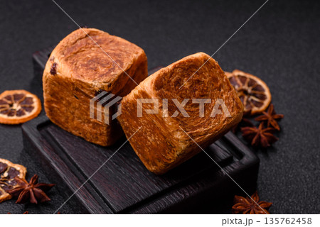 A French cube croissant with chocolate filling, a sweet breakfast pastry. Cube croissant A French cube croissant with chocolate filling, a sweet breakfast pastry. Cube croissant 135762458