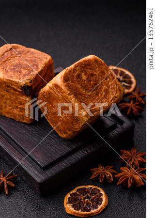A French cube croissant with chocolate filling, a sweet breakfast pastry. Cube croissant A French cube croissant with chocolate filling, a sweet breakfast pastry. Cube croissant 135762461