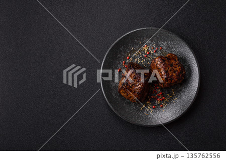 Grilled or barbecued beef steak, a fillet of meat cooked for dinner. Beef steak 135762556