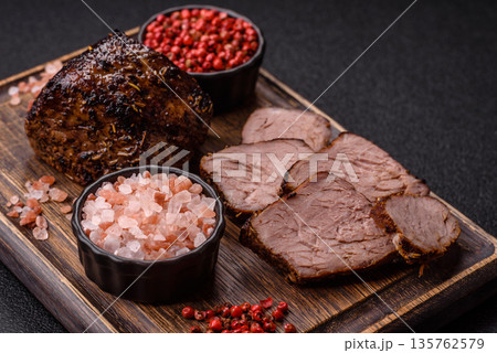 Grilled or barbecued beef steak, a fillet of meat cooked for dinner. Beef steak 135762579