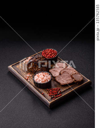 Grilled or barbecued beef steak, a fillet of meat cooked for dinner. Beef steak 135762585