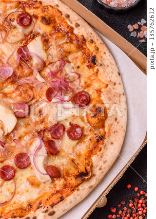 Italian pizza with sausage, chicken, and cheese for dinner. Sausage pizza 135762612