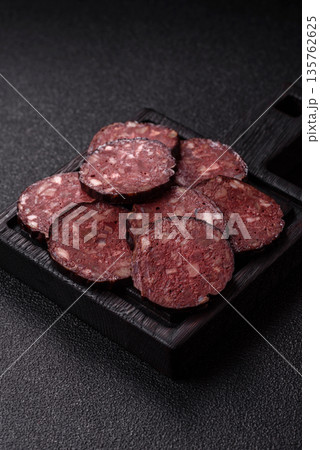 Black blood pudding, grilled pork sausage cooked for dinner. Blood pudding Black blood pudding, grilled pork sausage cooked for dinner. Blood pudding 135762625