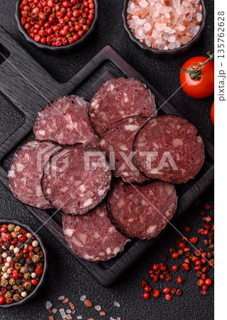 Black blood pudding, grilled pork sausage cooked for dinner. Blood pudding Black blood pudding, grilled pork sausage cooked for dinner. Blood pudding 135762628