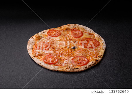 Vegetarian Margherita pizza with tomato, cheese, and sauce, for dinner. Margherita pizza Vegetarian Margherita pizza with tomato, cheese, and sauce, for dinner. Margherita pizza 135762649