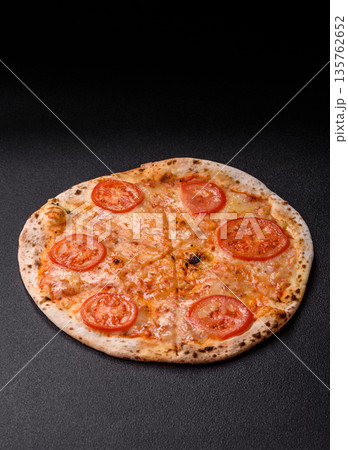 Vegetarian Margherita pizza with tomato, cheese, and sauce, for dinner. Margherita pizza 135762652