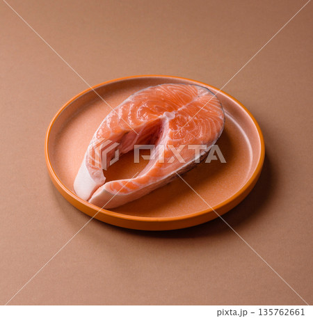 Fish, raw salmon steak, fresh seafood for grilling with salt, spices, and herbs. Raw salmon steak 135762661
