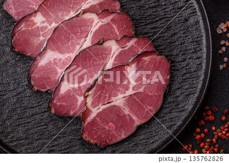 Meat, smoked ham, or pork sausage sliced for breakfast sandwiches. Sliced ham Meat, smoked ham, or pork sausage sliced for breakfast sandwiches. Sliced ham 135762826