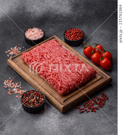 Raw ground beef or pork for burgers or meatballs with salt and spices. Raw ground beef Raw ground beef or pork for burgers or meatballs with salt and spices. Raw ground beef 135762864