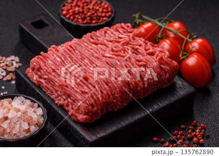 Raw ground beef or pork for burgers or meatballs with salt and spices. Raw ground beef Raw ground beef or pork for burgers or meatballs with salt and spices. Raw ground beef 135762890