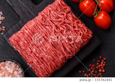 Raw ground beef or pork for burgers or meatballs with salt and spices. Raw ground beef Raw ground beef or pork for burgers or meatballs with salt and spices. Raw ground beef 135762891