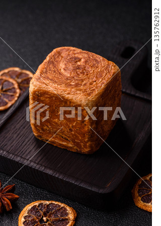 A French cube croissant with chocolate filling, a sweet breakfast pastry. Cube croissant A French cube croissant with chocolate filling, a sweet breakfast pastry. Cube croissant 135762912