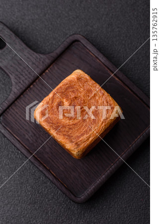 A French cube croissant with chocolate filling, a sweet breakfast pastry. Cube croissant A French cube croissant with chocolate filling, a sweet breakfast pastry. Cube croissant 135762915