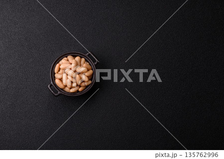 Canned white beans, prepared as an ingredient for a classic English breakfast. Canned beans Canned white beans, prepared as an ingredient for a classic English breakfast. Canned beans 135762996