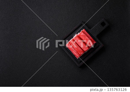 Fresh crab sticks for making a dinner salad. Crab sticks 135763126