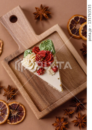 A slice of sweet layered cake with white cream for a birthday or holiday. A slice of cake 135763535