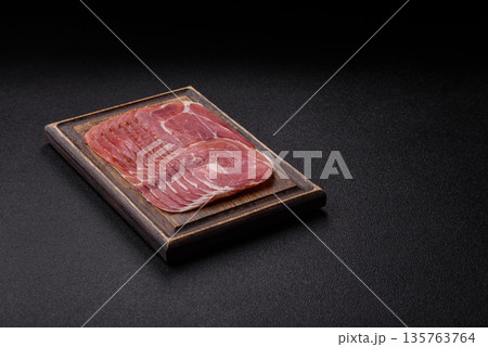 Meat, ham, jamon, or prosciutto sliced for breakfast bruschetta. Sliced ham, jamon, or prosciutto Meat, ham, jamon, or prosciutto sliced for breakfast bruschetta. Sliced ham, jamon, or prosciutto 135763764