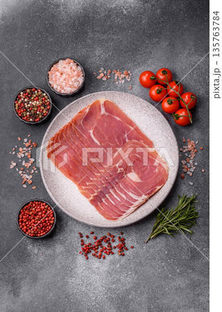 Meat, ham, jamon, or prosciutto sliced for breakfast bruschetta. Sliced ham, jamon, or prosciutto Meat, ham, jamon, or prosciutto sliced for breakfast bruschetta. Sliced ham, jamon, or prosciutto 135763784